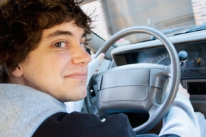 Teen boy driver behind the wheel